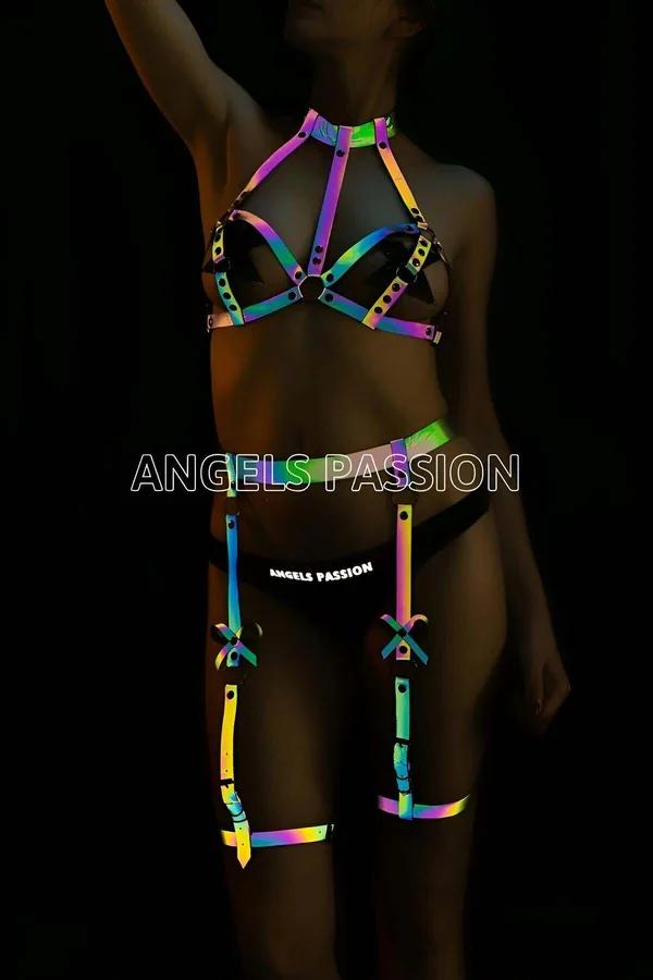 Reflective rainbow harness garter set glowing in neon violet green orange under flash light, cage chest harness and leg garte