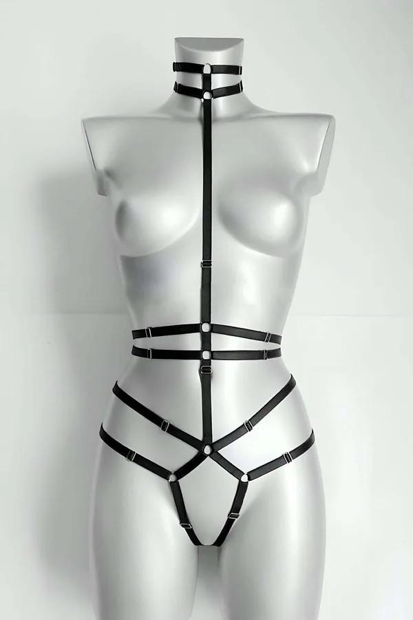 Black faux leather strappy full body harness with neck collar and silver O-rings on mannequin