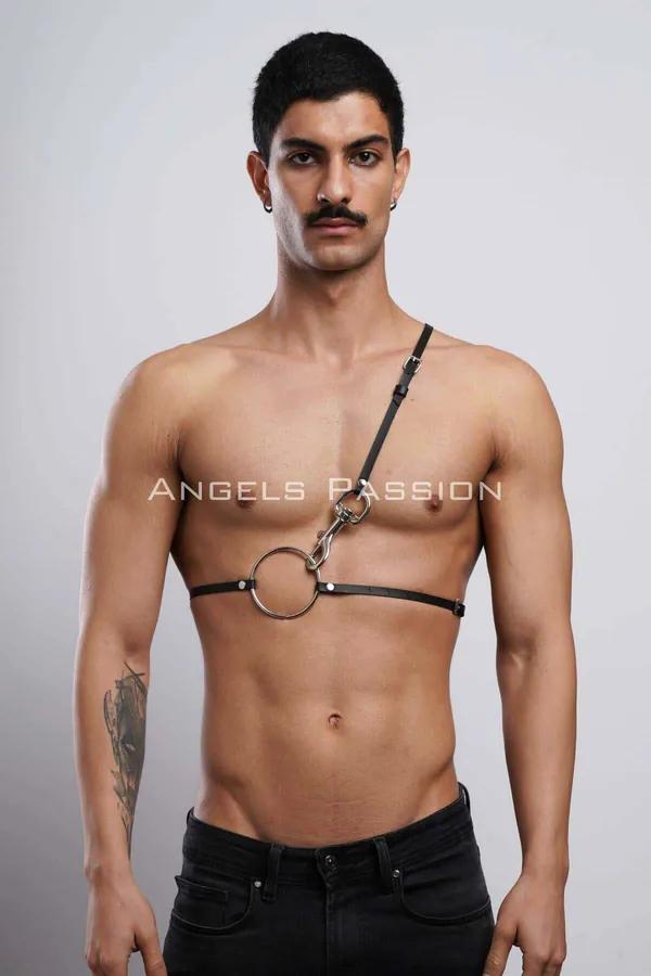 black faux leather O-ring chest harness with single adjustable diagonal shoulder strap on male model