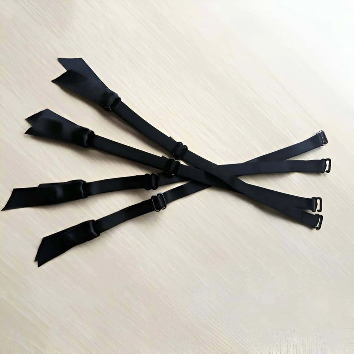 Black adjustable garter straps for hosiery with metal clips