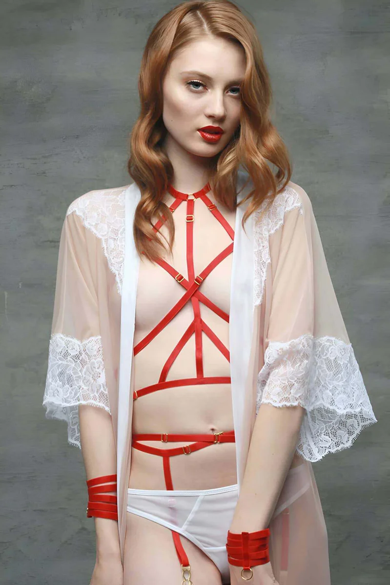 Red halter harness showing O-ring hardware detail on sheer robe