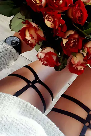 Black faux leather adjustable leg harness garter with multiple crossing straps