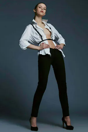 Black adjustable faux leather waist and chest harness worn over a white shirt