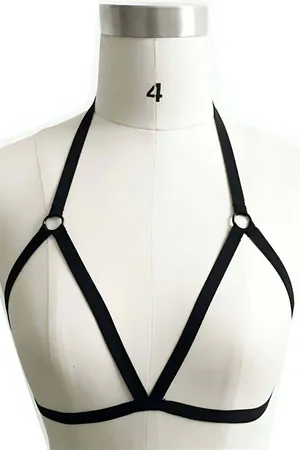 Black faux leather strappy chest harness with O-ring detail