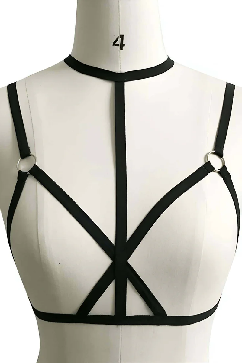 Festival outfit inspiration with black vegan leather body harness with metal rings and choker