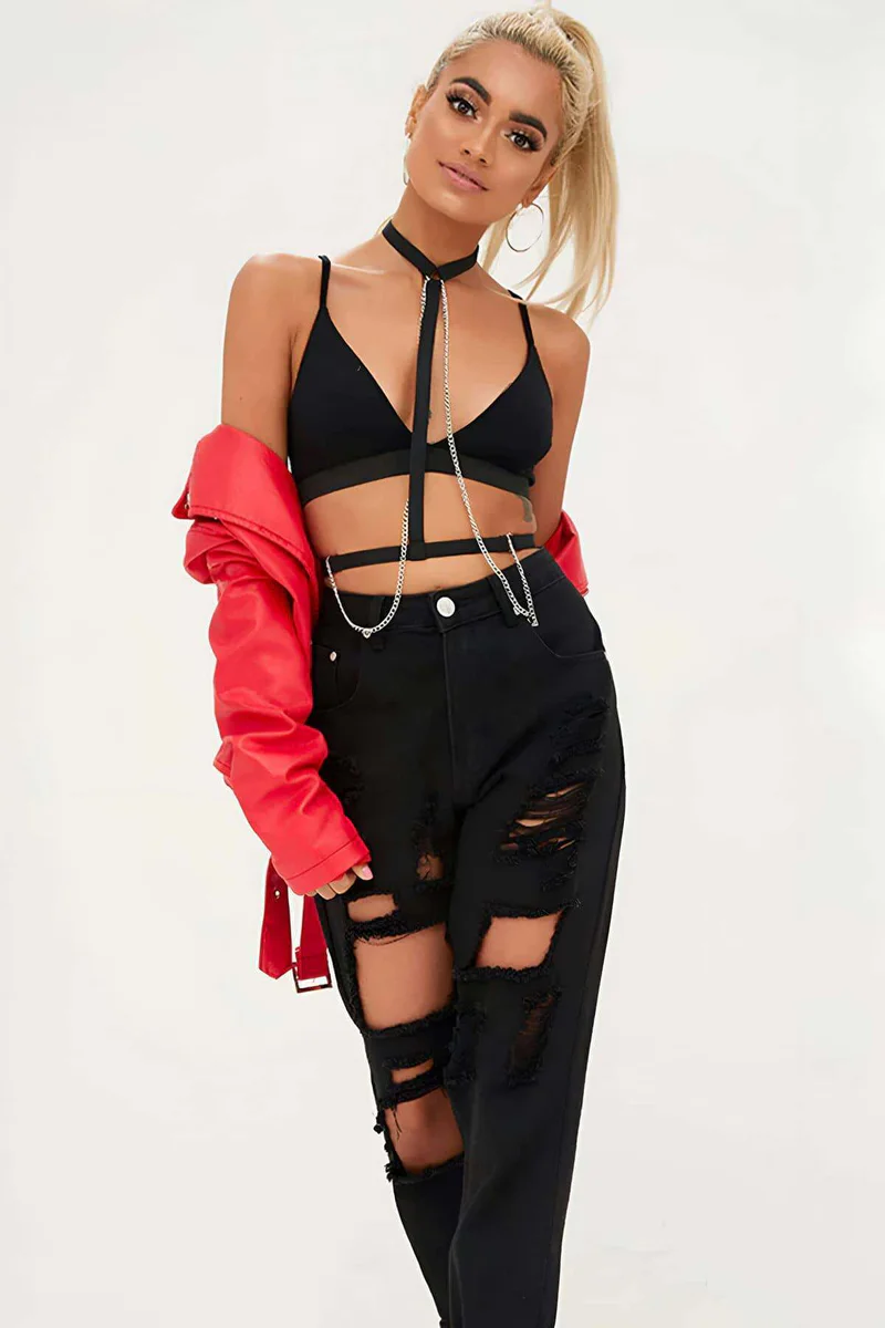 Black halterneck chain body harness detail showing silver hardware and straps