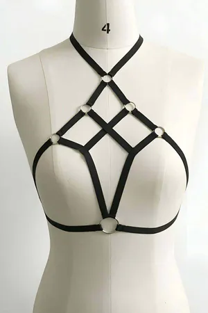 Black vegan leather strappy chest harness with multiple O-rings