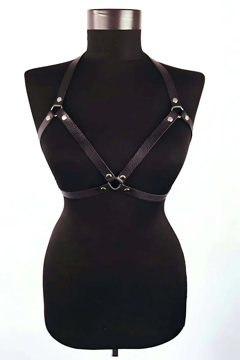 Black faux leather body harness with silver O-ring detail on mannequin