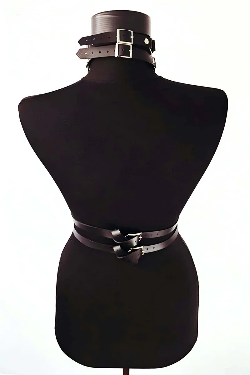 Back view of black faux leather body harness with adjustable straps and O-rings