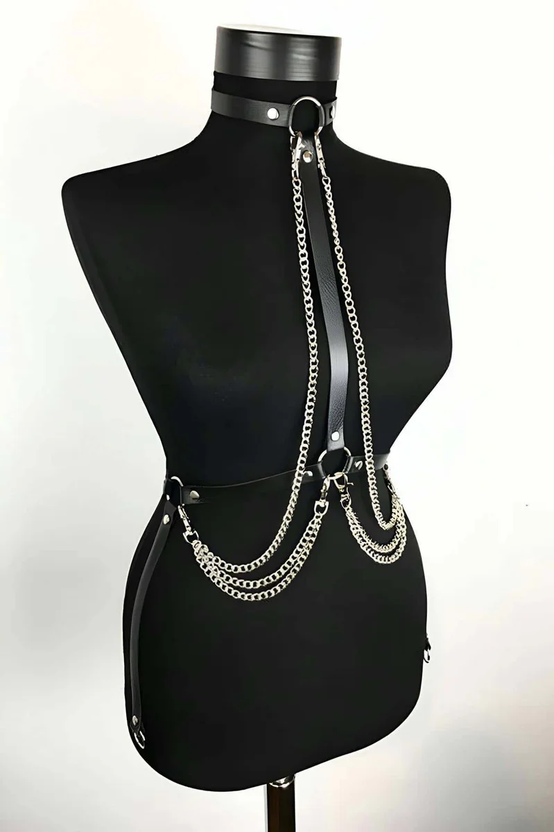 Black faux leather choker harness with layered silver chains and O-ring detail
