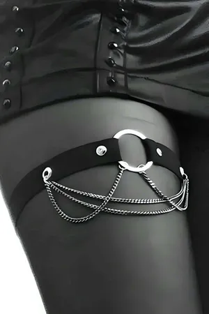 Black faux leather garter harness with silver chain draping and O-ring