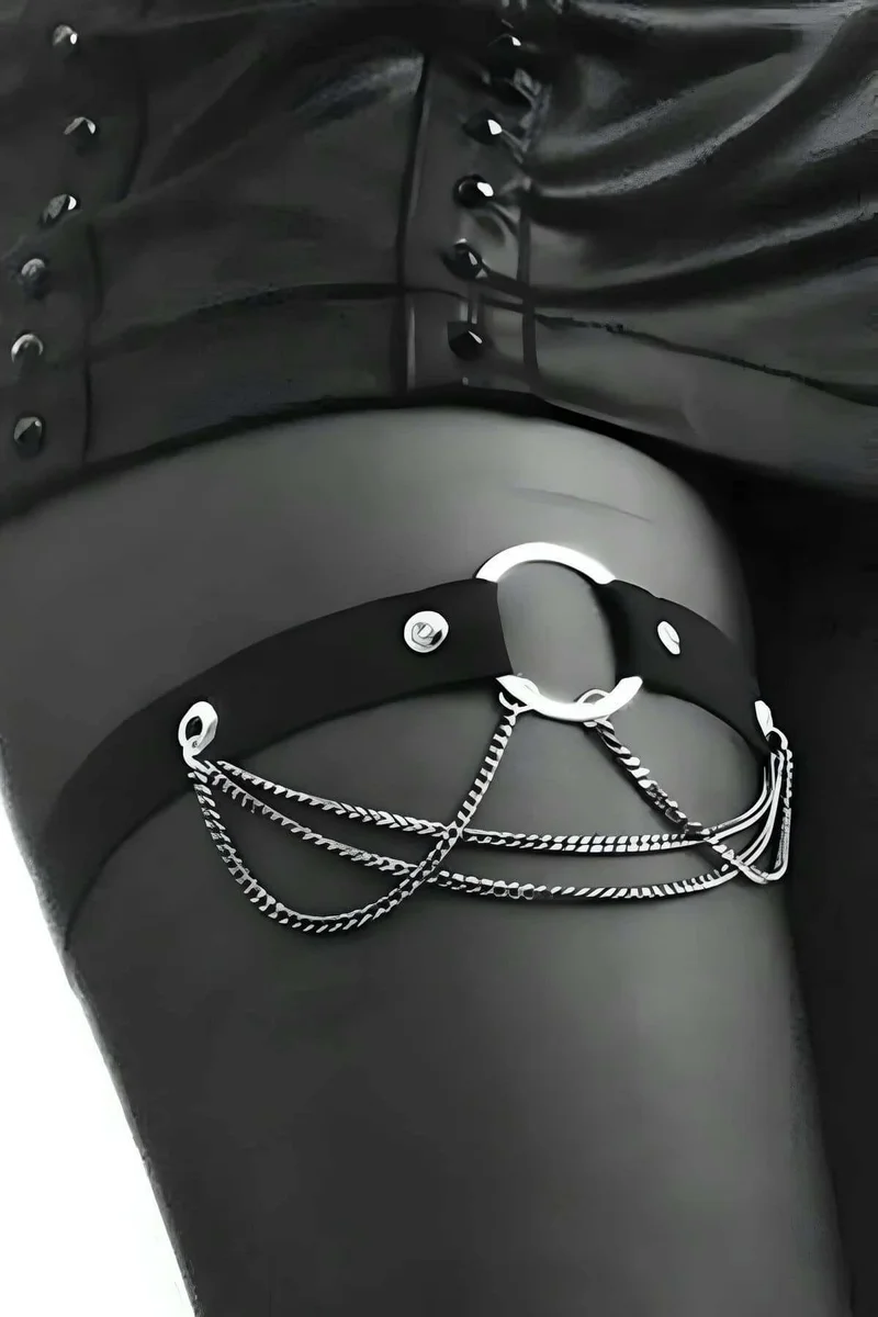 Black faux leather garter harness with silver chain draping and O-ring