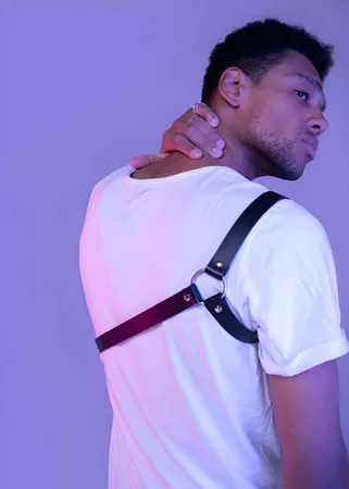 Black Faux Leather Single Shoulder Strap Harness with O-Ring Detail on a Man