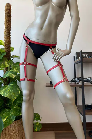 Red faux leather strappy thigh harness with O-rings and adjustable buckles