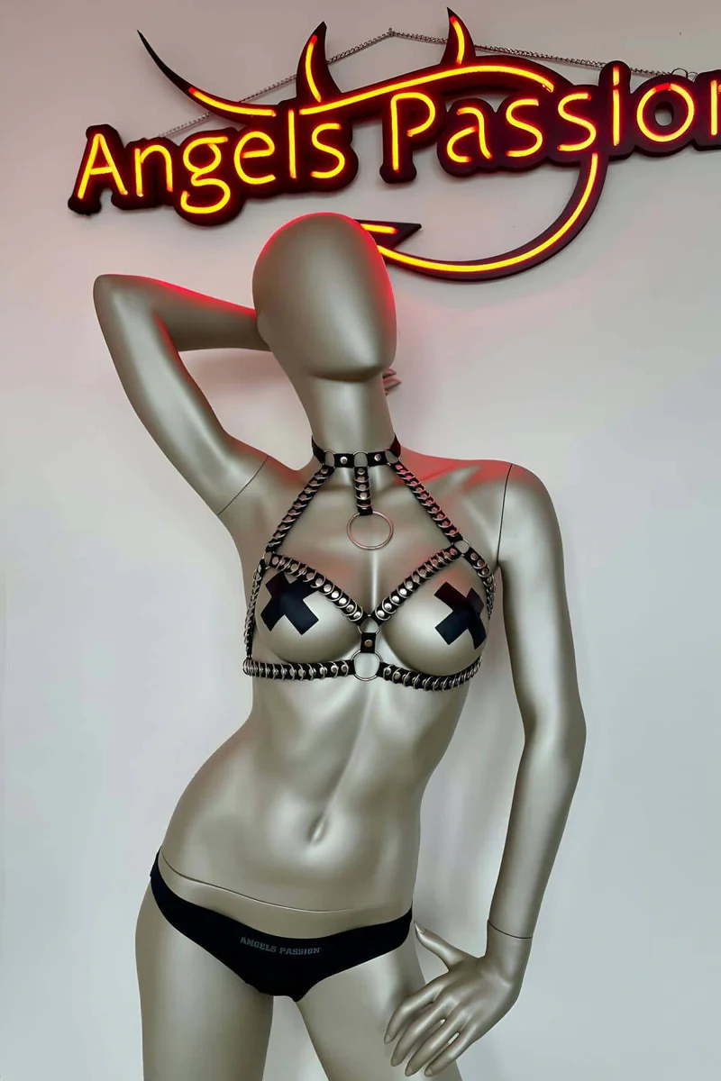 Black studded body harness with O-ring detail and cross nipple covers