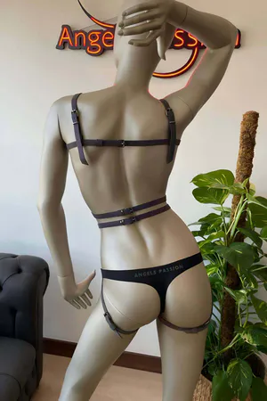 Reflective rainbow full body harness on mannequin with adjustable straps