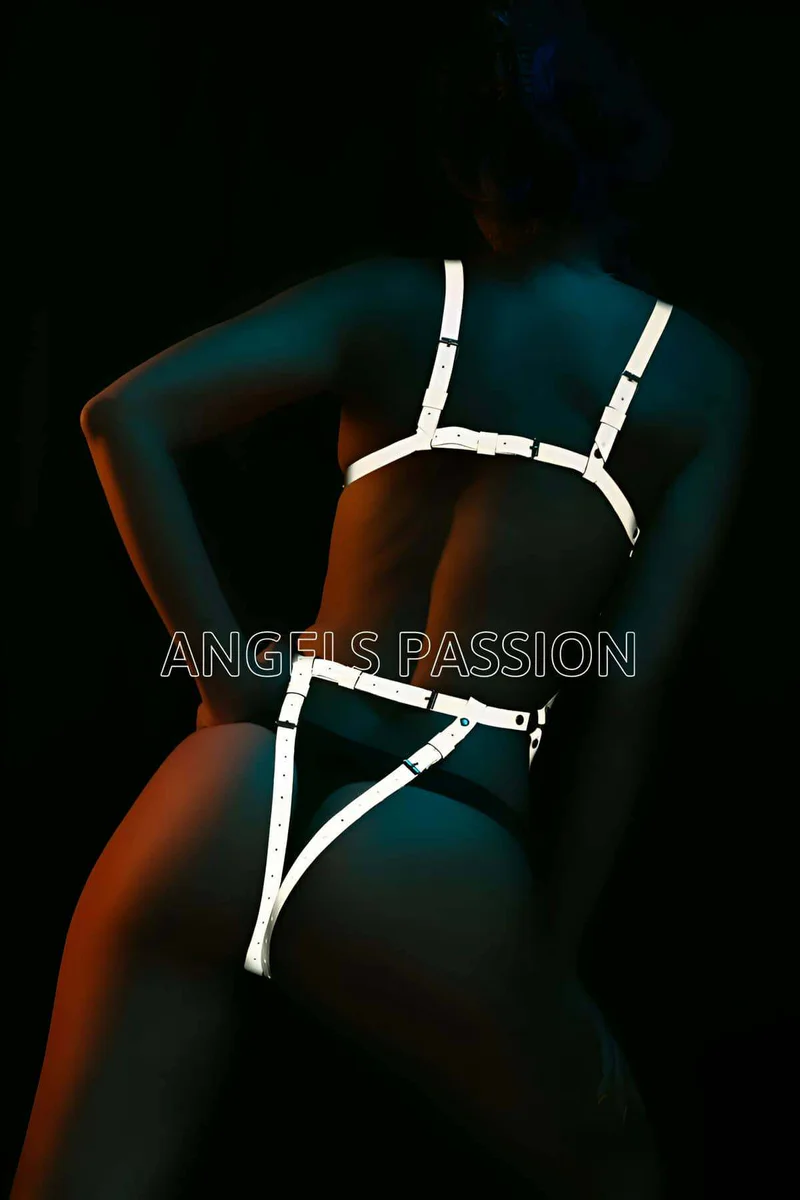 Side profile of white reflective full body harness showing strap layout and triangle bottom