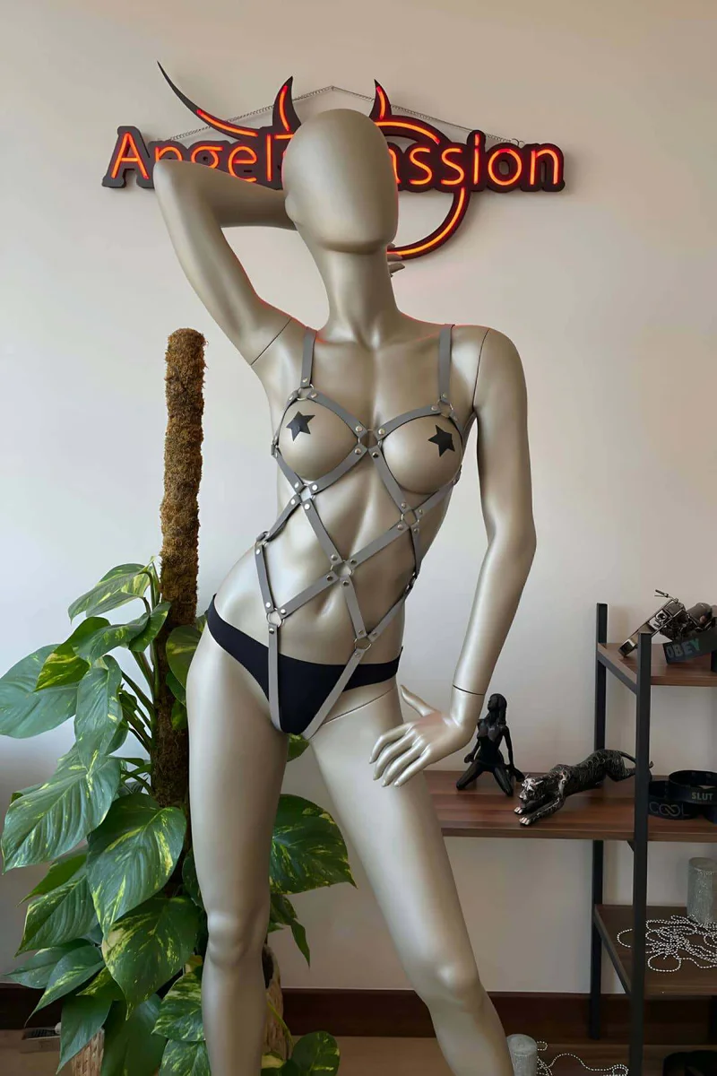 Silver festival harness with star pasties and geometric strap detail