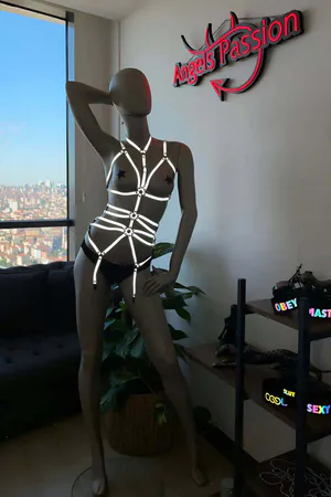 Reflective full body harness with O-ring accents in silver on a mannequin
