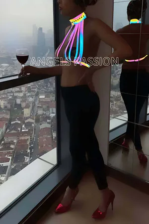 Reflective rainbow body harness with choker detail on a woman