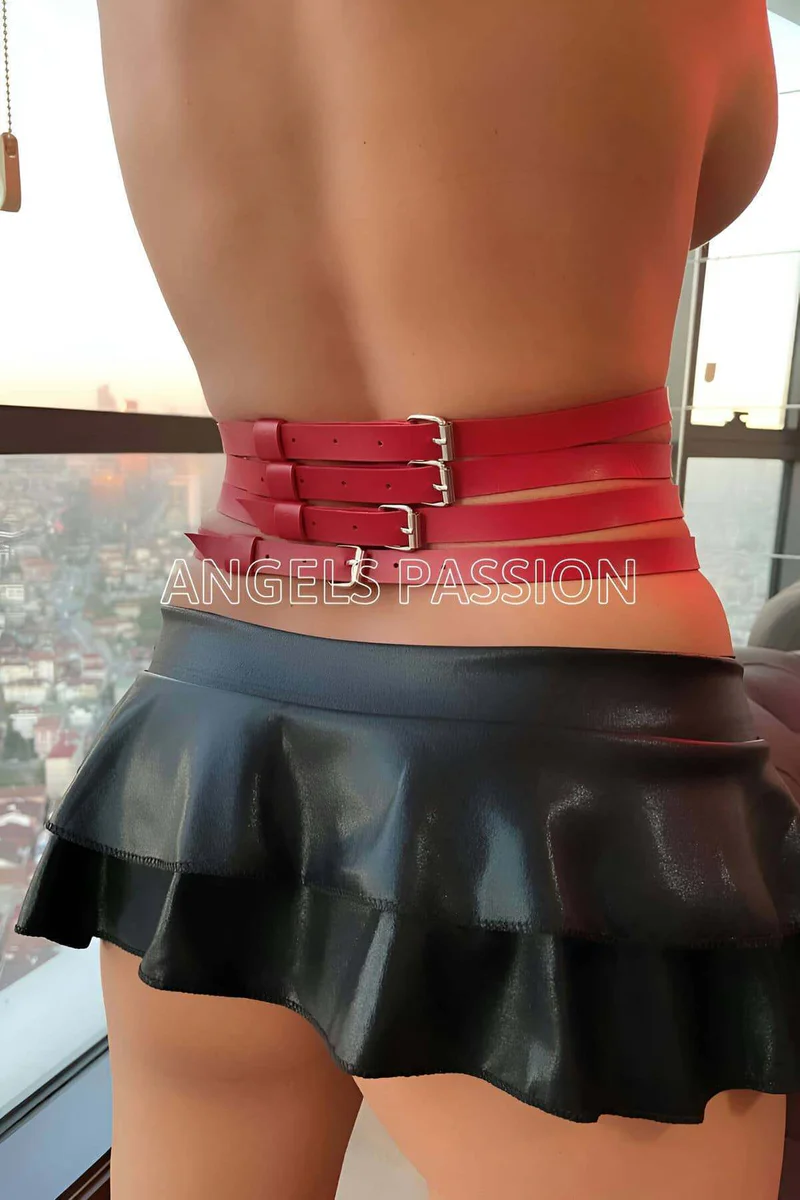 Red faux leather waist harness O-ring detail close-up