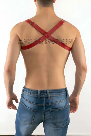 Red faux leather chest harness with criss-cross straps and O-ring detail