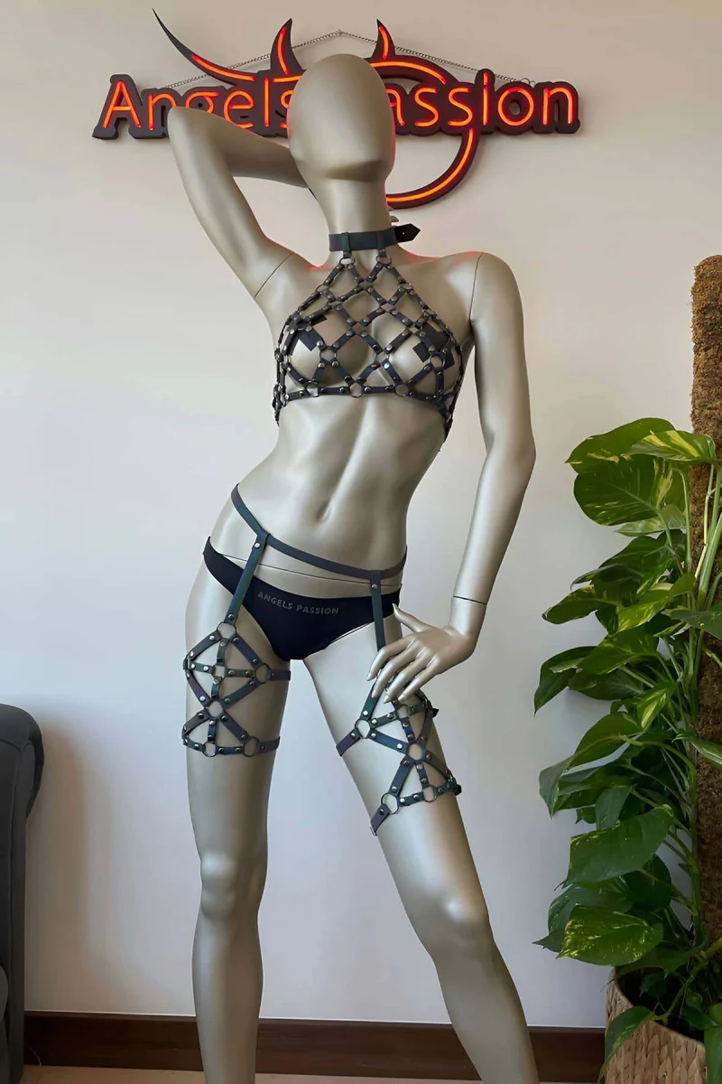 Festival outfit featuring the iridescent reflective body harness with garter straps and thigh chains