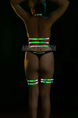 Iridescent reflective body harness set with leg straps for women, adjustable straps and metal hardware.