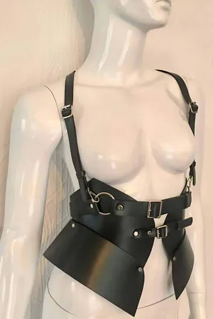 Black asymmetrical faux leather body harness with O-ring and chain detail