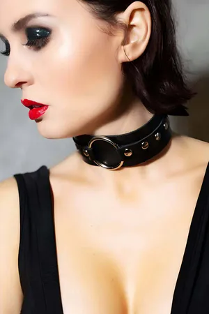 Black Faux Leather O-Ring Choker with Brass Studs Worn by Woman