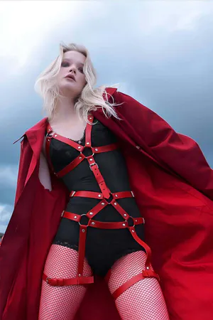 Red faux leather full body harness with adjustable straps and silver O-rings