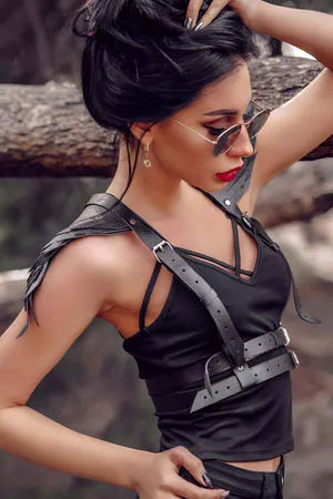 Black faux leather body harness with double buckle waist belt and adjustable shoulder straps
