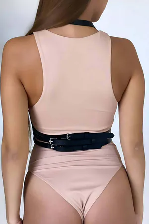 Black faux leather body harness with adjustable straps and silver O-ring details