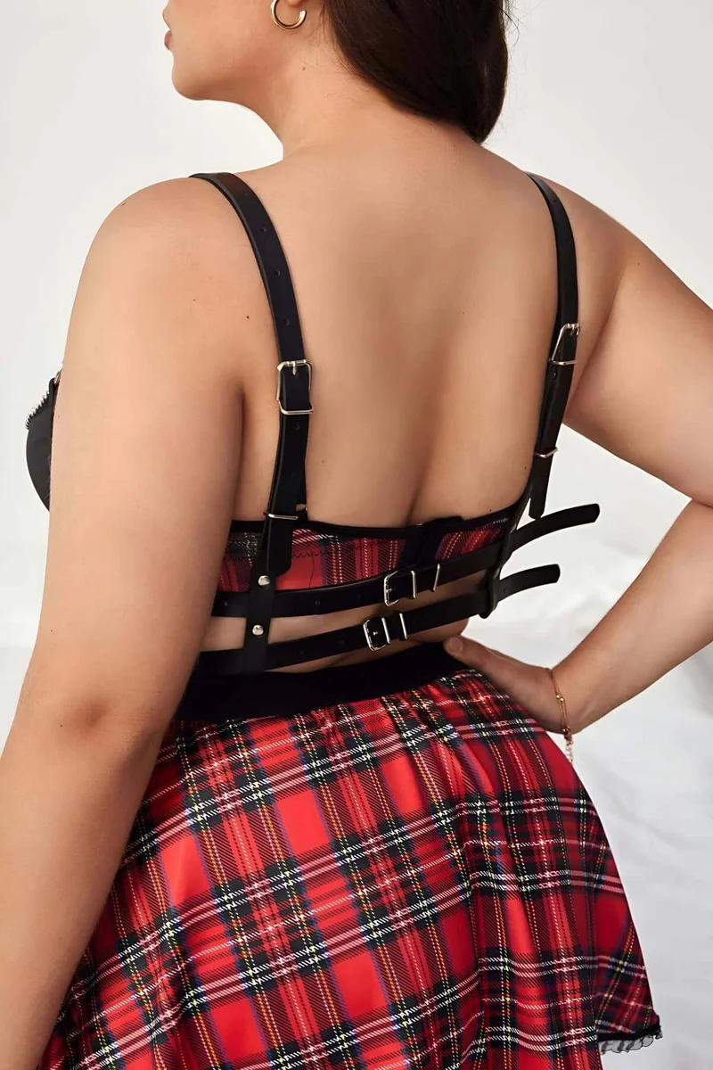 Back view of adjustable black faux leather harness straps with buckle details
