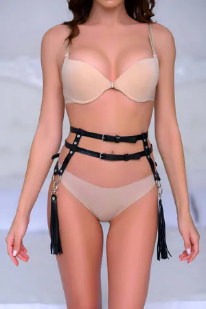 Black faux leather waist harness with silver buckles and black tassels