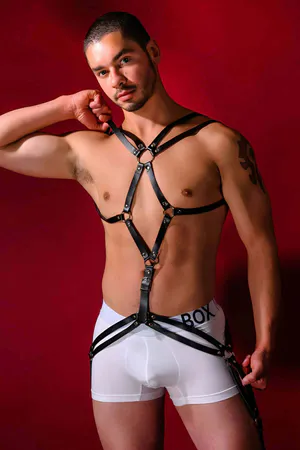 Black faux leather strappy body harness with O-rings and adjustable straps