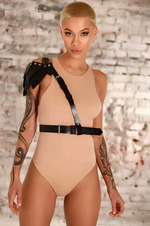Black vegan leather asymmetrical shoulder harness with adjustable waist belt