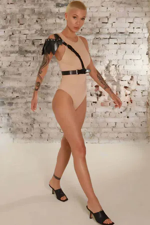 Black vegan leather asymmetrical shoulder harness with adjustable waist belt