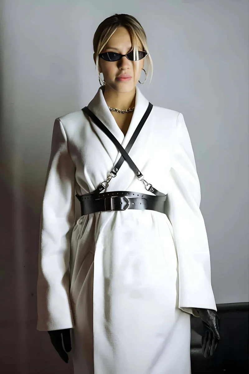 Close-up of the silver buckle hardware on the black waist harness belt
