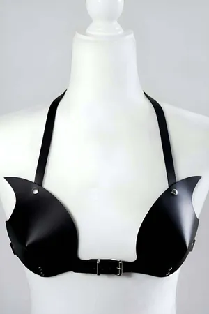 Black faux leather bra harness with molded cups and silver buckle closure