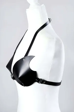 Black faux leather bra harness with molded cups and silver buckle closure