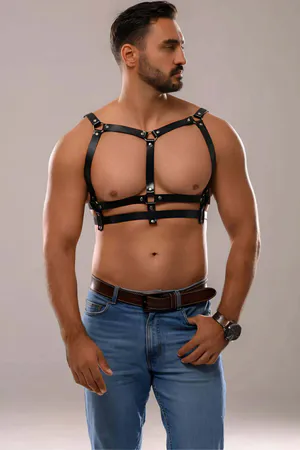 Black faux leather chest harness with adjustable straps and gunmetal hardware