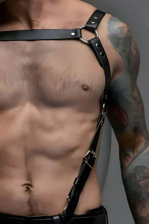 Black adjustable chest harness with O-ring accent and metal buckle