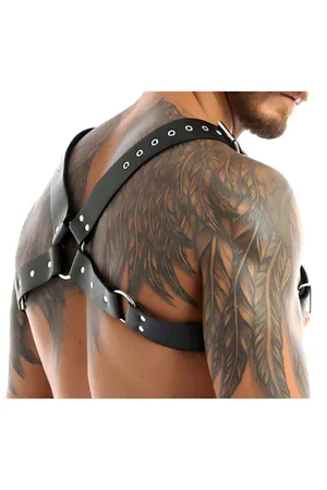 Black faux leather chest harness with adjustable straps and O-ring detail