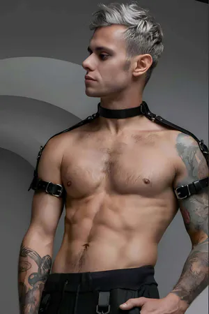 Black faux leather choker and shoulder harness set on male model