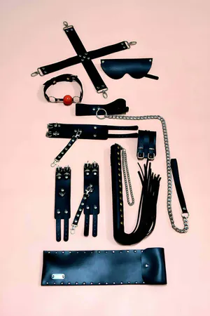 Black Faux Leather 7-Piece Accessory and Restraint Set with Cuffs and Paddle