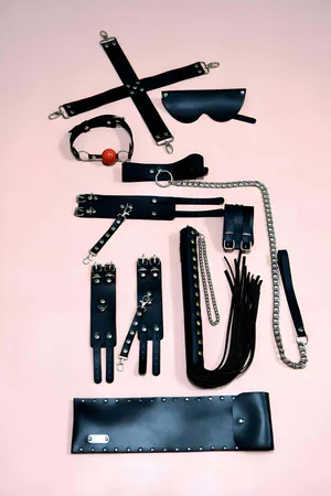 Black Faux Leather 7-Piece Accessory and Restraint Set with Cuffs and Paddle