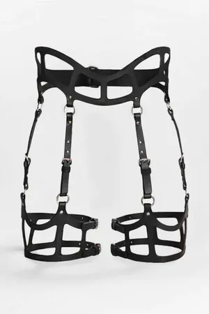 Black structured cage garter harness with angular waist detail and adjustable thigh bands