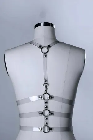 Transparent PVC body harness with silver O-ring details and adjustable buckles