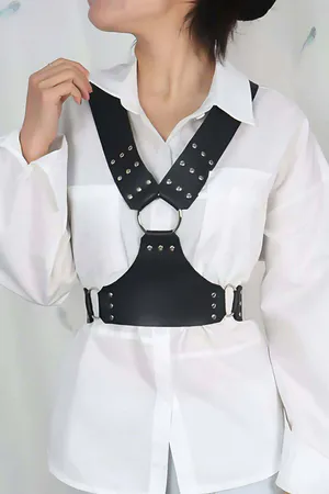 Black faux leather studded chest harness with silver O-ring detail